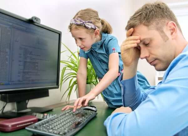 a man trying to work from home while his daughter is distracting him