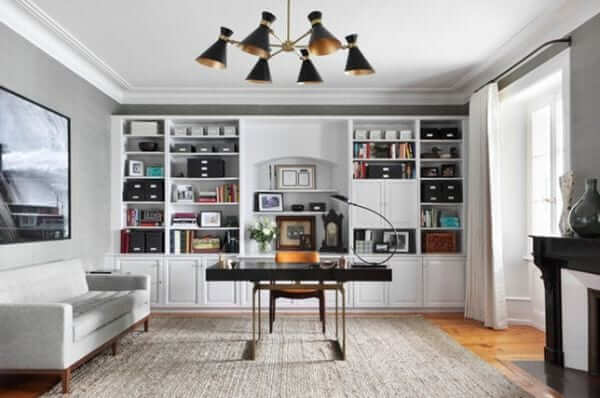 a spacious home office with book shelves