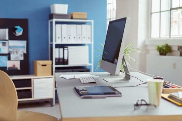 a computer screen on a desk inside a home office