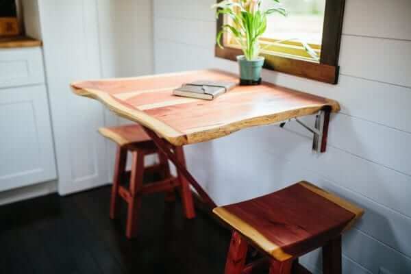 a space saving dining table in a tiny home