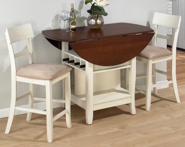 a drop down dining table with two chairs in a corner