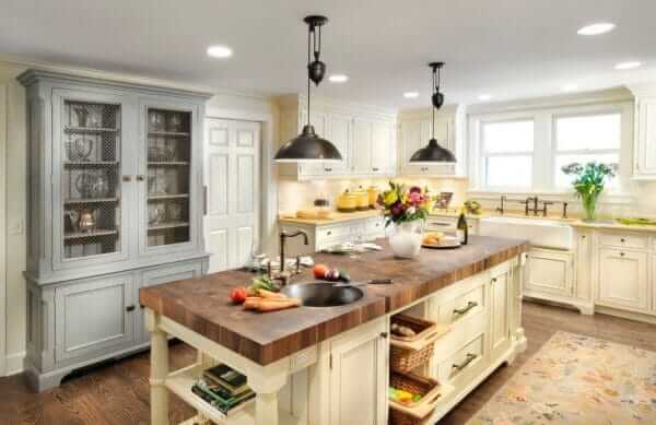 A clean modern kitchen featuring a versatile island kitchen placed at the center