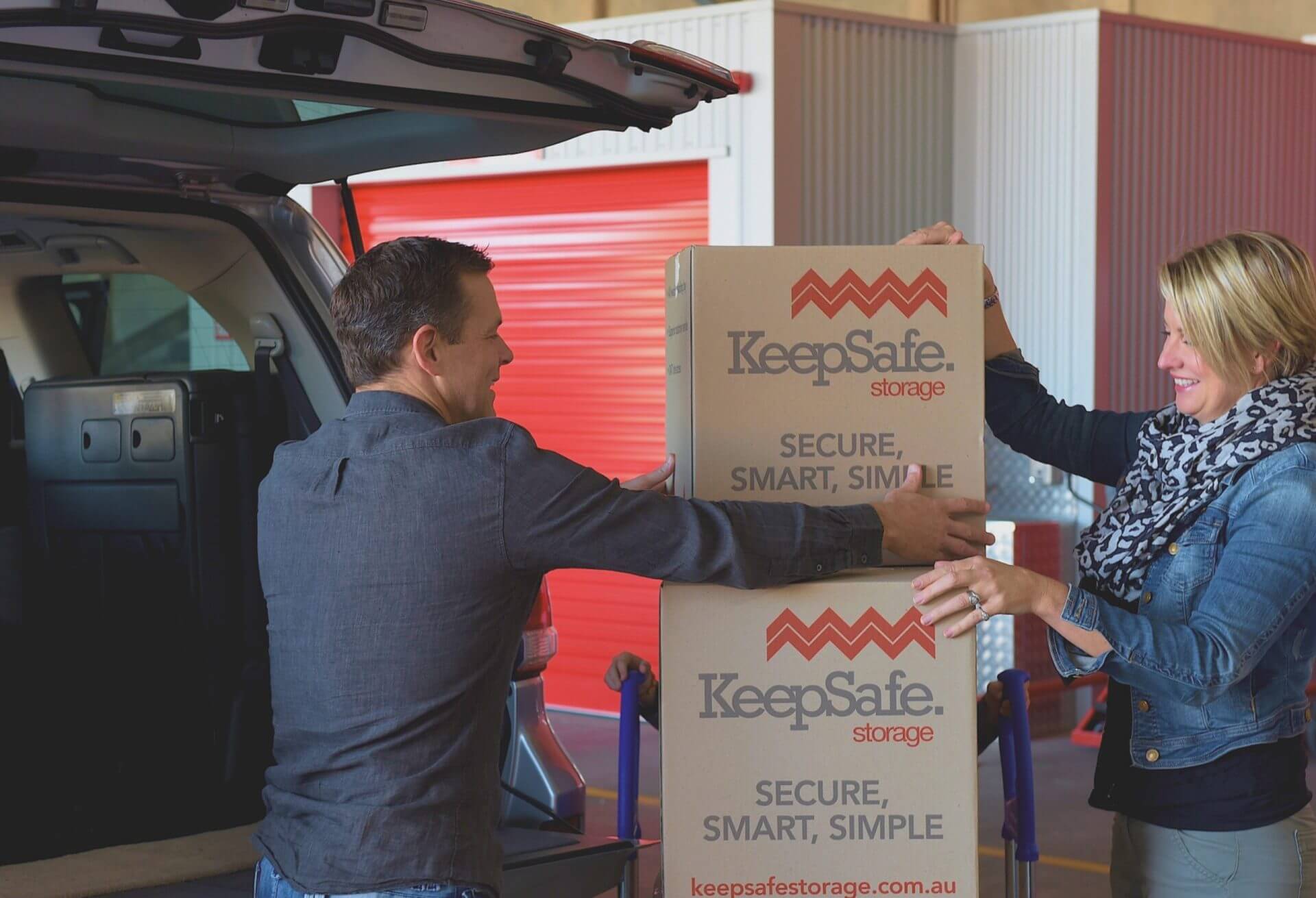 Couple loading keepsafe boxes